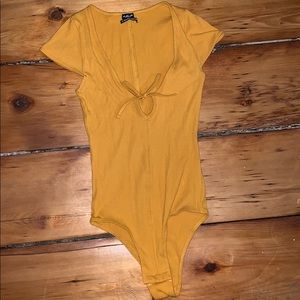 Yellow body suit